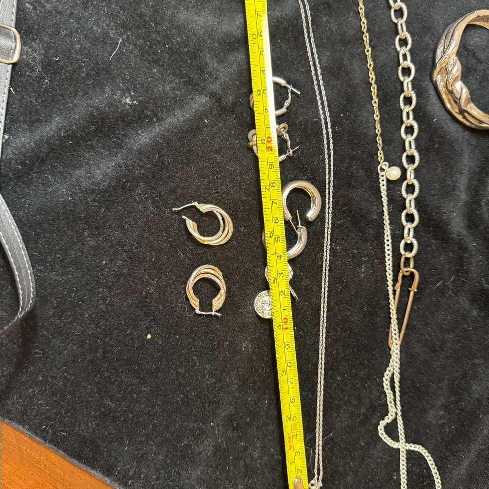 Variety of Silvertone Hoop Earrings, necklace and bracelet.